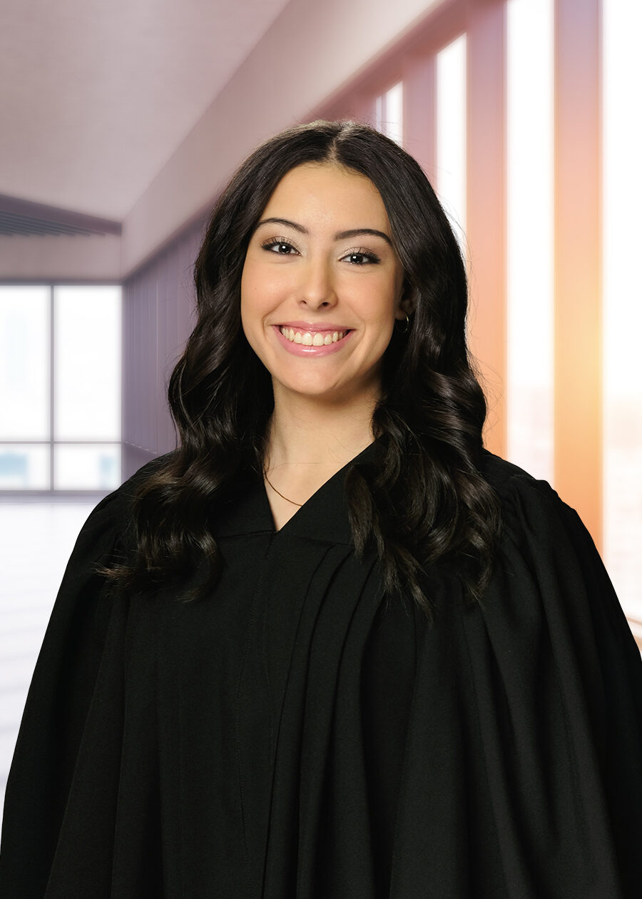 A high school graduation portrait of a girl wearing a graduation gown